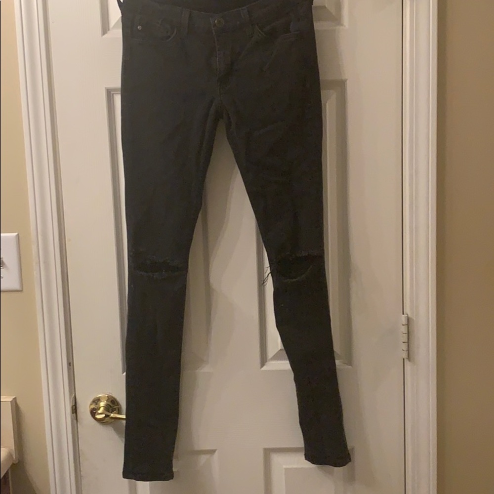Black jeans with knee holes